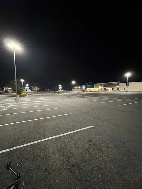Large commercial lot restriped overnight with crisp white stall lines