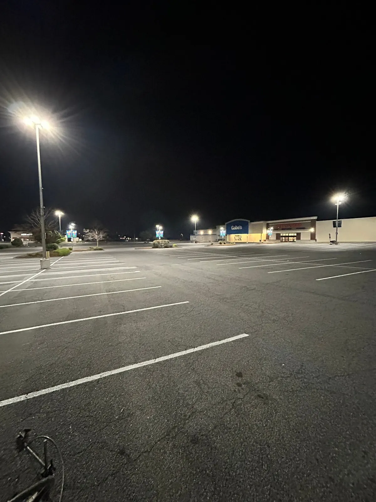 Large commercial lot restriped overnight with crisp white stall lines