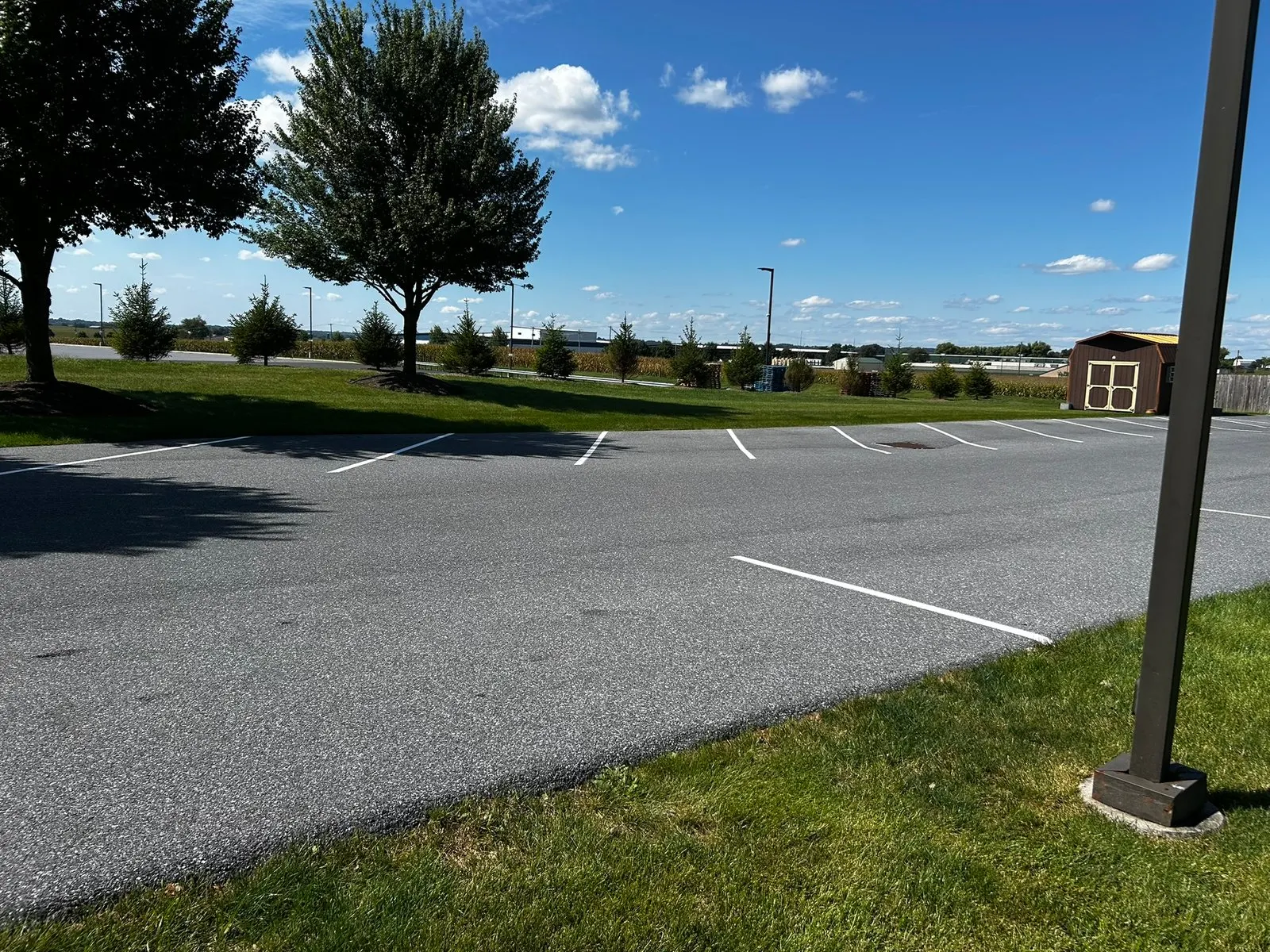 New white stall line next to a lawn at an office park
