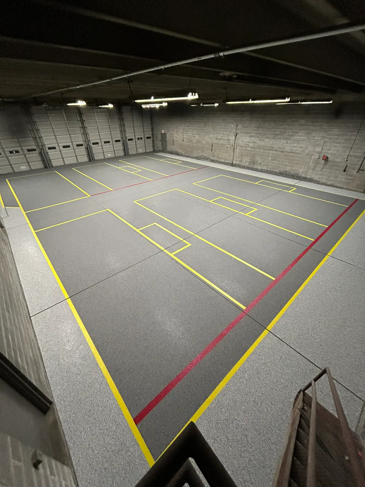 Yellow and red safety line layout painted on a warehouse floor