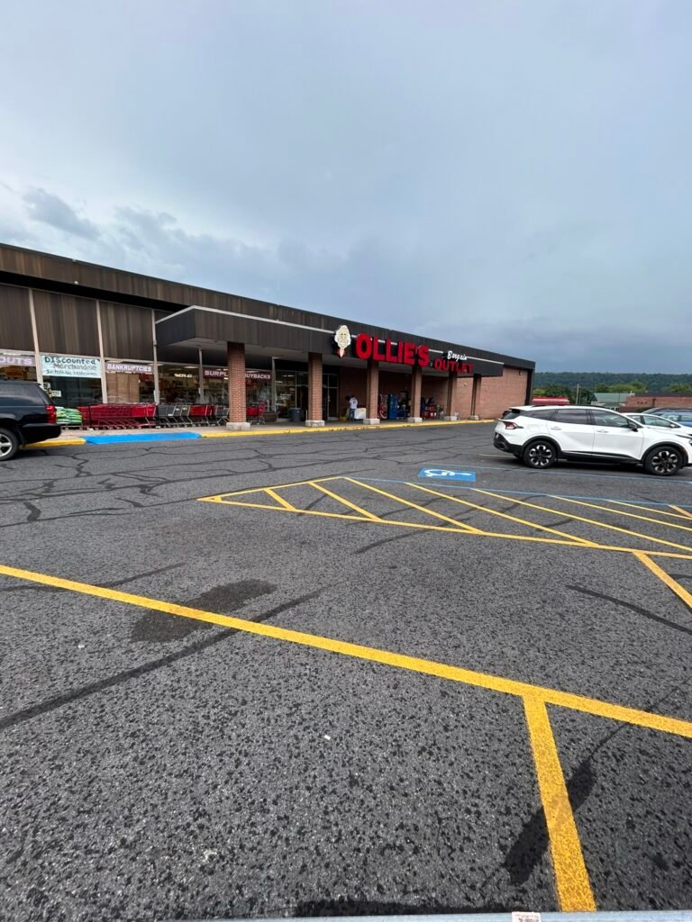 ADA compliant blue handicap parking stall stenciling and van accessible cross-hatching