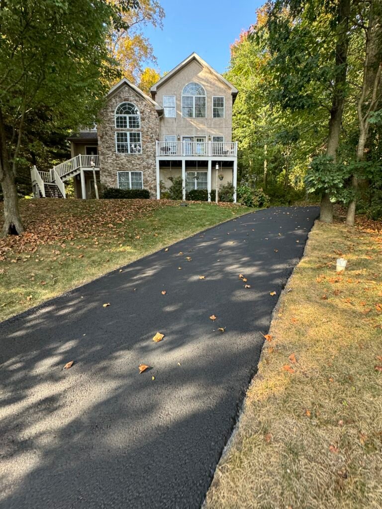 House with newly paved driveway